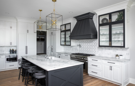 black and white kitchen, white kitchen, custom kitchen, kitchens of instagram, two toned cabinets, wood range hood, brass hardware